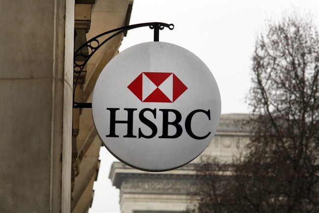 The logo of British bank HSBC is visible on the facade of HSBC France headquarters on the Champs Elysees in Paris, Monday Feb. 9, 2015. 