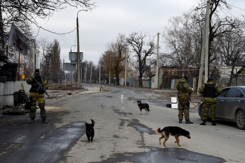 Pro-Russian separatist fighters stand guard at a checkpoint near the airport of Donetsk on Febuary 7, 2015. 