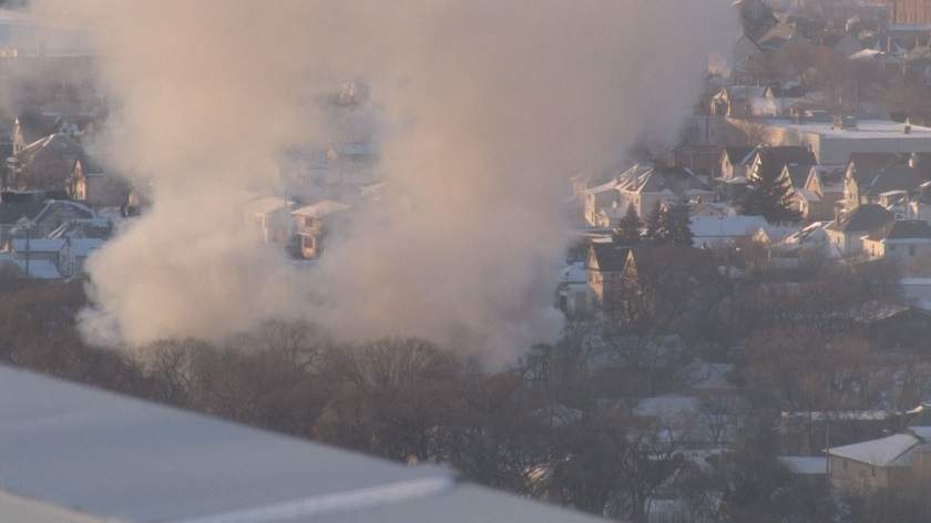 Afternoon fire on Elgin Avenue spreads to two homes.
