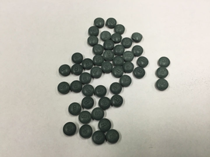Photo of pills believed to be fake oxycontin found at a residence in Prince Albert, Sask. on Feb. 23, 2015.