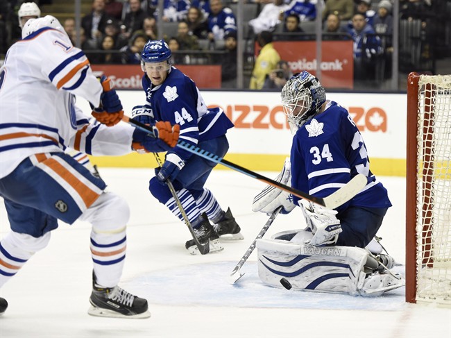 Toronto Maple Leafs goalie James Reimer stops Edmonton Oilers' Nail Yakupov during third period NHL action in Toronto on Saturday, Feb. 7, 2015.