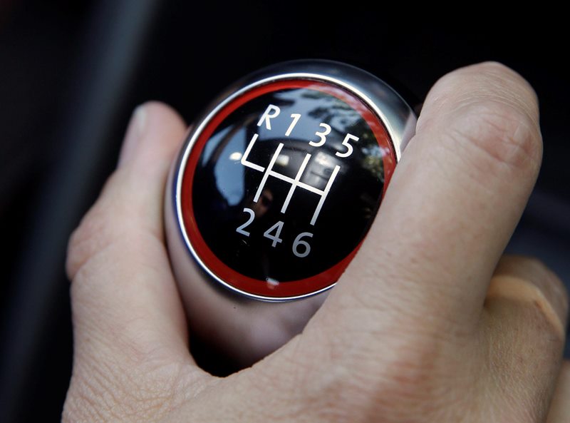 Police say a man attempting an armed carjacking bailed when he couldn't drive a stick shift.