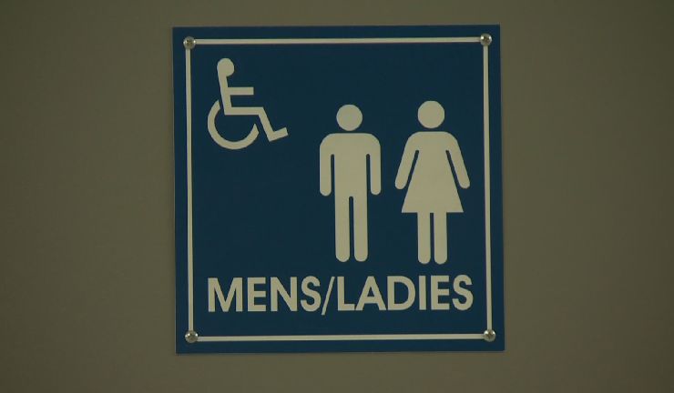 In this file photo a sign shows a gender-neutral washroom. Advocates are pushing for more gender-neutral bathrooms in Quebec schools. Thursday, Feb. 2, 2017.