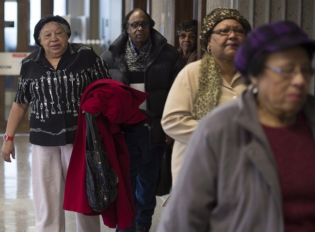 Former residents of Africville and supporters attend Nova Scotia Supreme Court in Halifax on Wednesday, Feb. 25, 2015. The group wants to amend a statement of claim as they attempt to advance a proposed class-action suit against the city seeking compensation for land that was taken by the city in the 1960s. 
