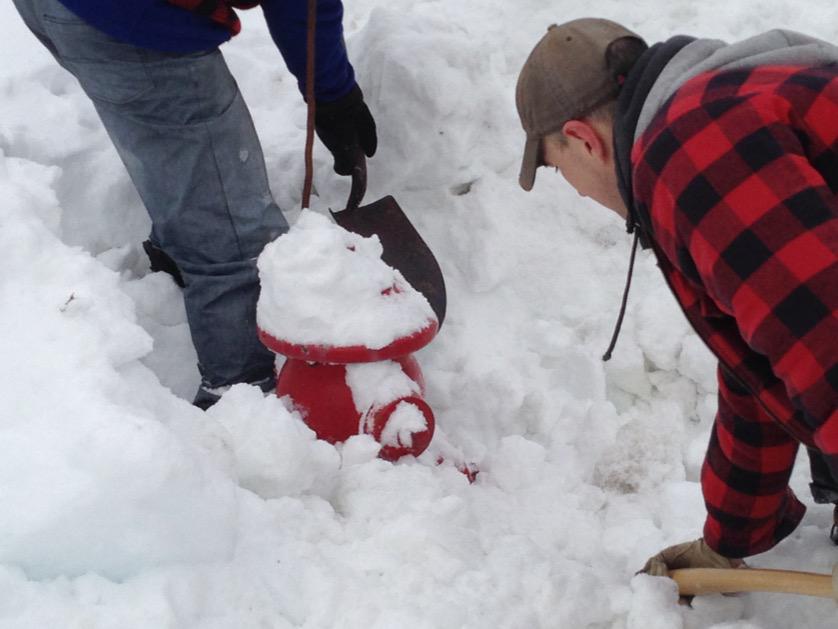Off-duty firefighters cleared snow from more than 20 fire hydrants in their Dartmouth neighbourhood on Sunday.