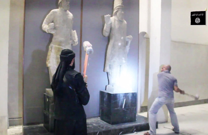 Islamic State militants attack ancient artifacts with sledgehammers in the Ninevah Museum in Mosul, Iraq. The group posted the video showing the destruction to a YouTube account on Feb. 26, 2015.