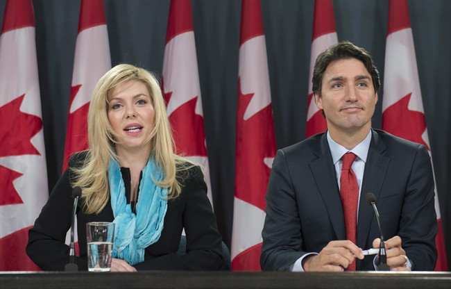Former Conservative MP Eve Adams (left) is joined by Liberal Leader Justin Trudeau as she announces in Ottawa on Monday, Feb. 9, 2015 that she is leaving the Conservative Party to join the Liberal Party of Canada. THE CANADIAN PRESS/Justin Tang.