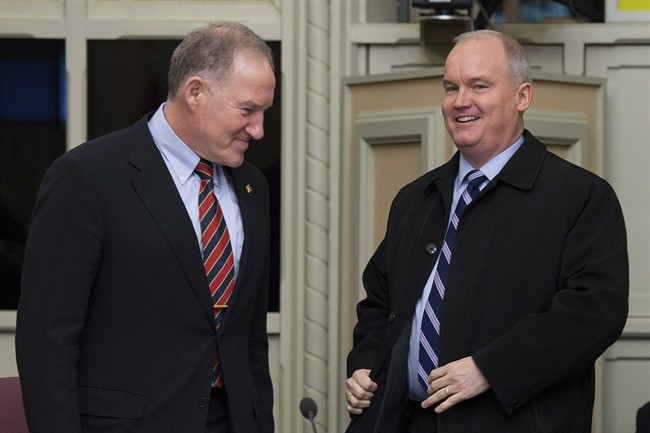 Veterans Affairs Minister Erin O'Toole (right) and Deputy Veterans Affairs Minister retired Gen. Walt Natynczyk arrive to appear as witnesses at a Senate veterans committee to discuss Bill C-27, the Veterans Hiring Act, on Parliament Hill in Ottawa on Wednesday, Feb. 25, 2015.