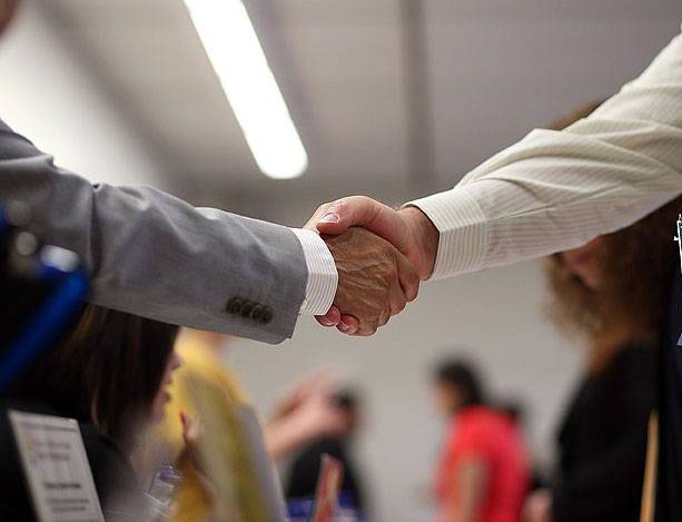 A job seeker (R) shakes hands with a recruiter for the Fremont Unified School District during a job fair at the Alameda County Office of Education on April 24, 2013 in Hayward, California. Over 100 job seekers attended the annual education job fair hosted by the Alameda County Office of Education where 200 jobs were available ranging from teachers to IT professionals.