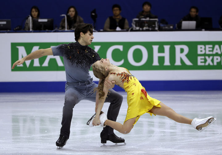 Kaitlyn Weaver and Andrew Poje perform the free dance on their way to winning the ice dance title in the ISU Four Continents Figure Skating Championships in Seoul, South Korea, Friday, Feb. 13, 2015. 