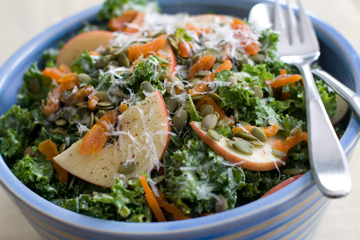 This March 10, 2014 photo shows kale salad with apples apricots and manchego cheese in Concord, N.H.
