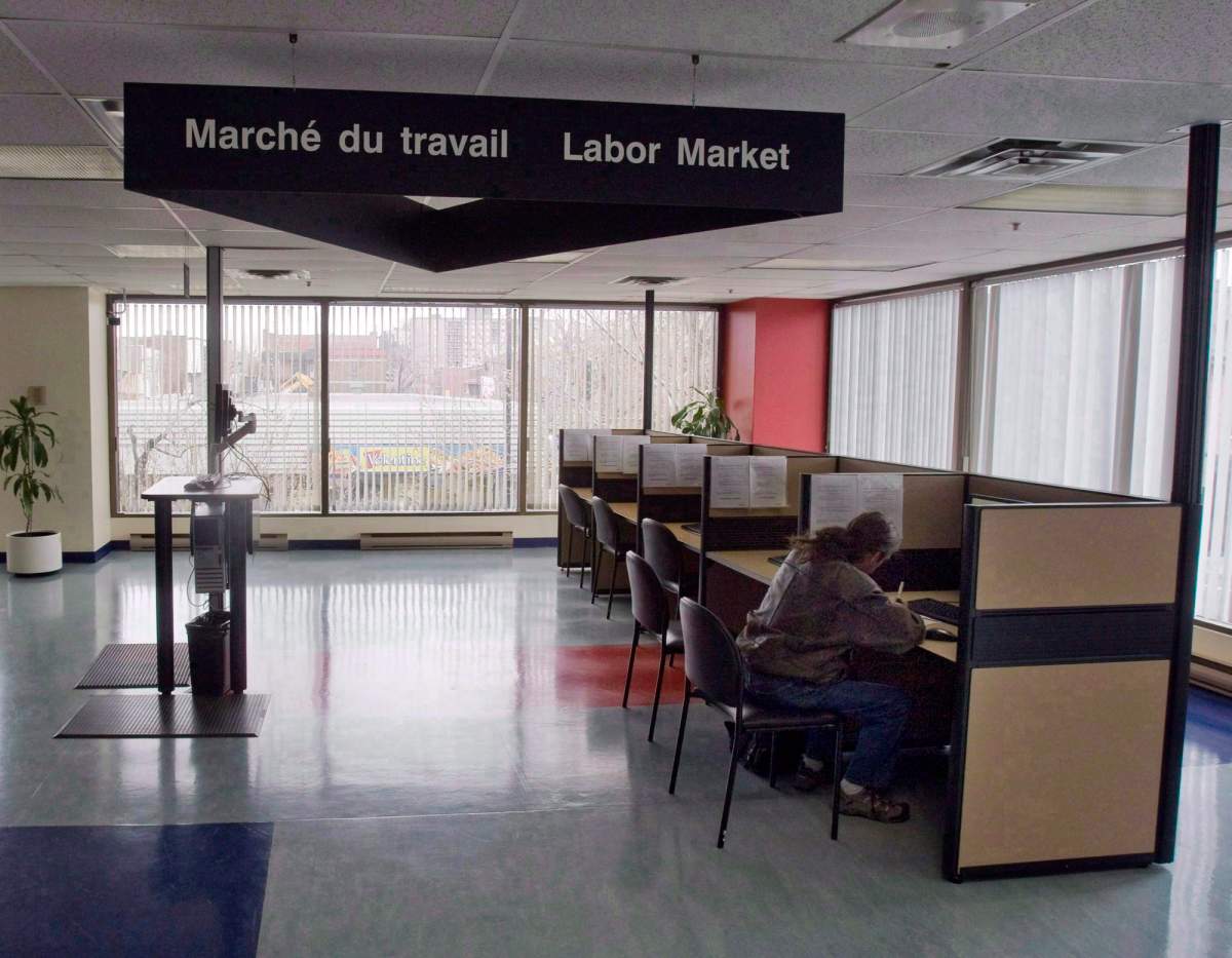 A man looks through jobs at a Resource Canada office in Montreal.