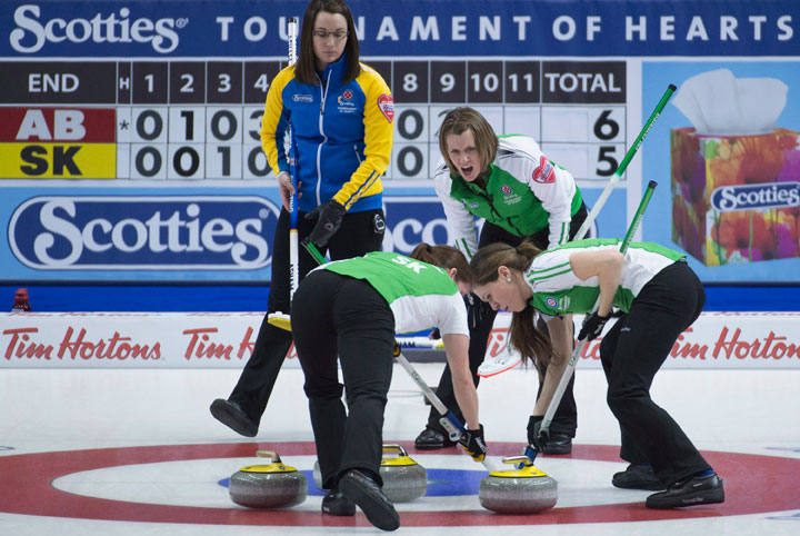 Alberta skip Val Sweeting, left, watches as Saskatchewan skip Stefanie Lawton calls in a shot during semi-final action at the Scotties Tournament of Hearts in Moose Jaw, Sask. Saturday, Feb. 21, 2015.