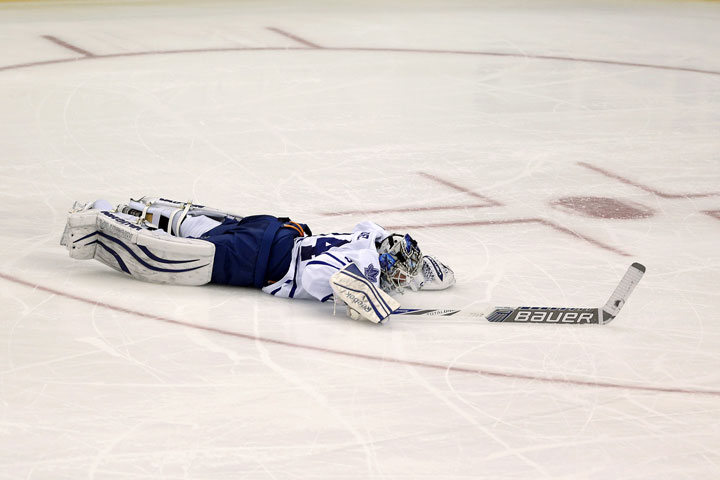 Toronto Maple Leafs goalie James Reimer lies on the ice after New Jersey Devils right wing Jaromir Jagr, of the Czech Republic, scored during the third period of an NHL hockey game, Friday, Feb. 6, 2015, in Newark, N.J.