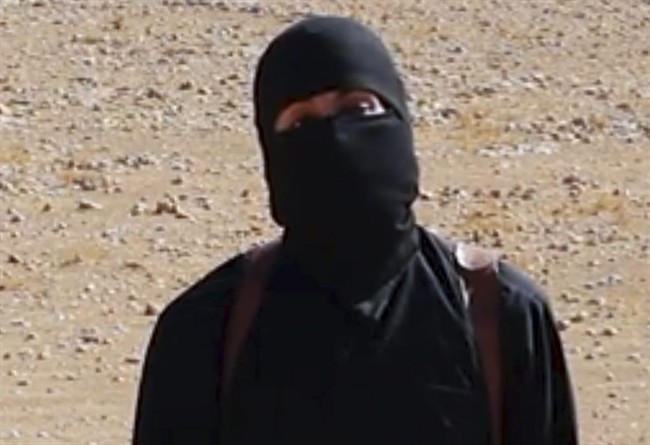 FILE - This undated image shows a frame from a video released Friday, Oct. 3, 2014, by Islamic State militants that purports to show the militant who beheaded of taxi driver Alan Henning . A British-accented militant who has appeared in beheading videos released by the Islamic State group in Syria over the past few months bears "striking similarities" to a man who grew up in London, a Muslim lobbying group said Thursday Feb. 26, 2015.
