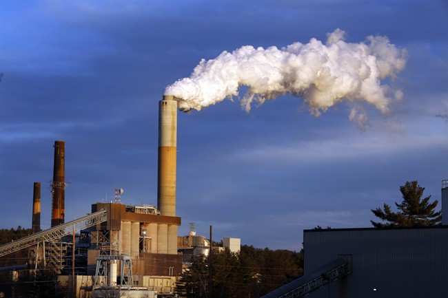  In this Tuesday, Jan. 20, 2015, file photo a plume of smoke billows from the coal-fired Merrimack Station in Bow, N.H. 
