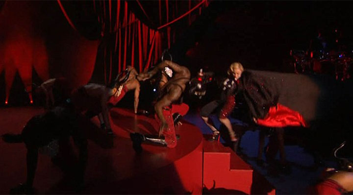 A screen grab of the moment Madonna was pulled backwards down a set of steps.