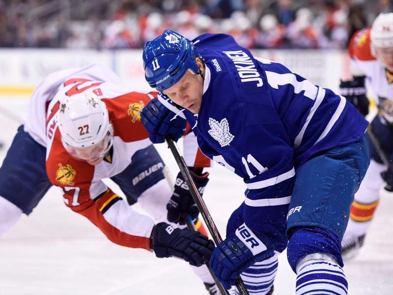Toronto Maple Leafs' Olli Jokinen (11) faces off against Florida Panthers' Nick Bjugstad (27) during first period NHL action in Toronto on Tuesday, Feb. 17, 2015. 