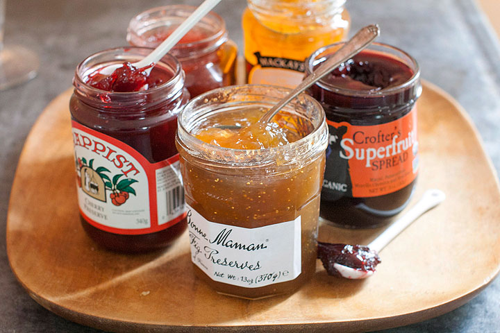 This June 9, 2014 photo shows an assortment of jams from left to right, Trappist cherry preserve, Bonne Maman fig preserves, Mackays dundee orange marmalade and Crofter's superfruit spread in Concord, N.H.