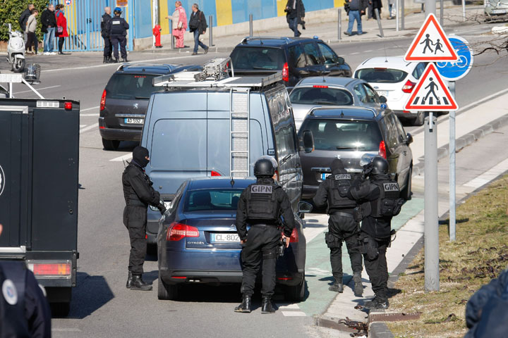 Police officers block the entrance of the Castellane housing project of Marseille, southern France, Monday, Feb.9, 2015. 