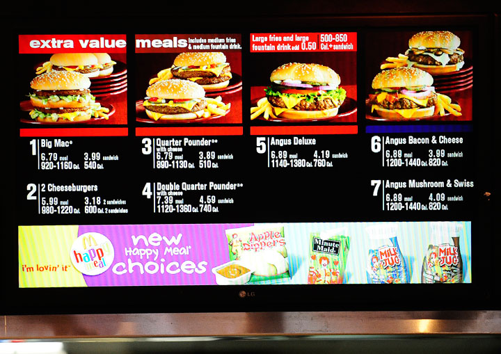 A menu displays US fast food chain McDonald's beef burger menu, in New York, January 28, 2011.