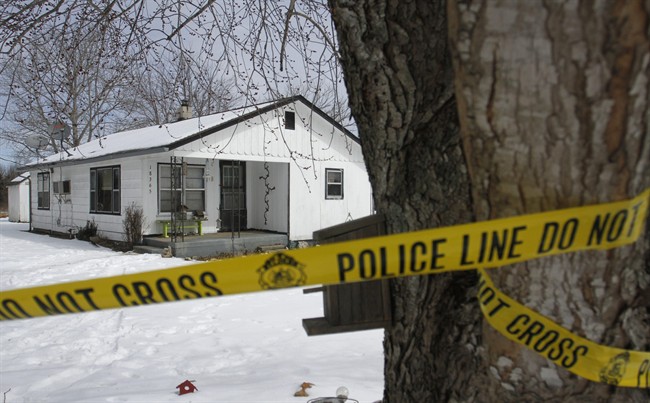 Police tape surrounds one of five crime scenes near Tyrone, Mo., on Friday morning, Feb. 27, 2015. 