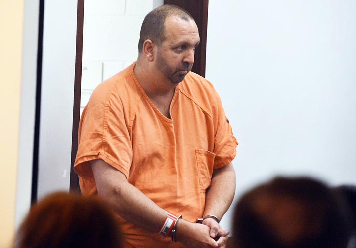 Craig Stephen Hicks, 46, enters the courtroom for his first appearance at the Durham County Detention Center on Wednesday, Feb. 11, 2015 in Durham, N.C.   Hicks, 46, is accused of shooting three people at a quiet condominium complex near the University of North Carolina campus. 