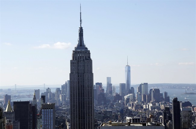 The Empire State Building and the Manhattan skyline are seen from the Rainbow Room, New York City’s landmark restaurant atop 30 Rockefeller Plaza, in this Sunday, Oct. 5, 2014 file photo.