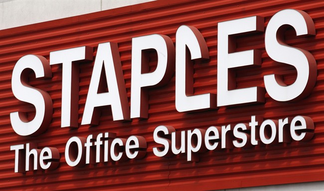 In this May 17, 2011 file photo, a Staples sign is displayed on the front of a Staple store, in Portland, Ore. 