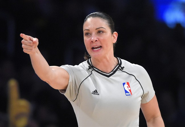 In this Jan. 9. 2015, file photo, referee Lauren Holtkamp makes a call during an NBA basketball game between the Los Angeles Lakers and the Orlando Magic in Los Angeles.