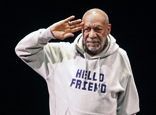 FILE - In this Jan. 17, 2015 file photo, comedian Bill Cosby salutes the crowd as he begins a performance at the Buell Theater in Denver.
