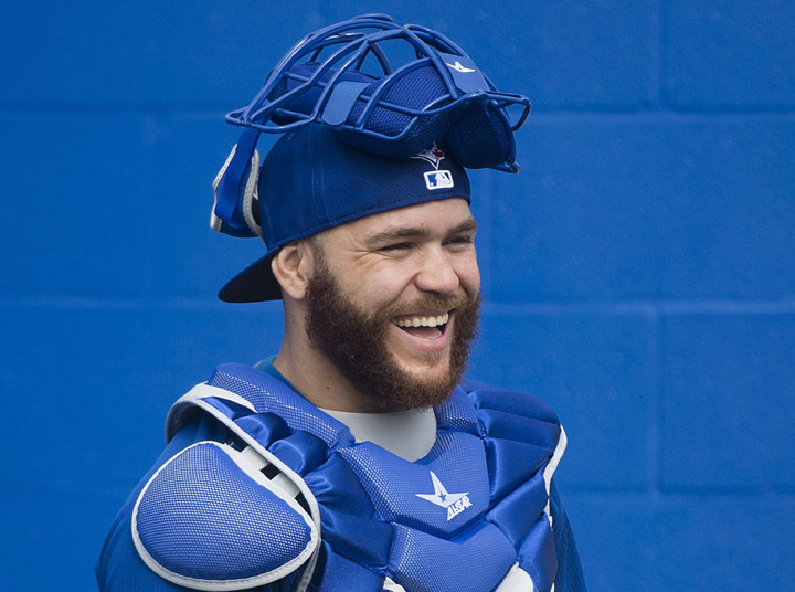 Toronto Blue Jays catcher Russell Martin smiles after catching a bullpen session during baseball spring training in Dunedin, Fla., on Monday, February 23, 2015. 