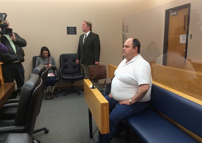 Nelson Hart, right, and his lawyer, Jeff Brace, centre, appear in provincial court in St. John's, N.L., on Tues. Feb. 17, 2015.