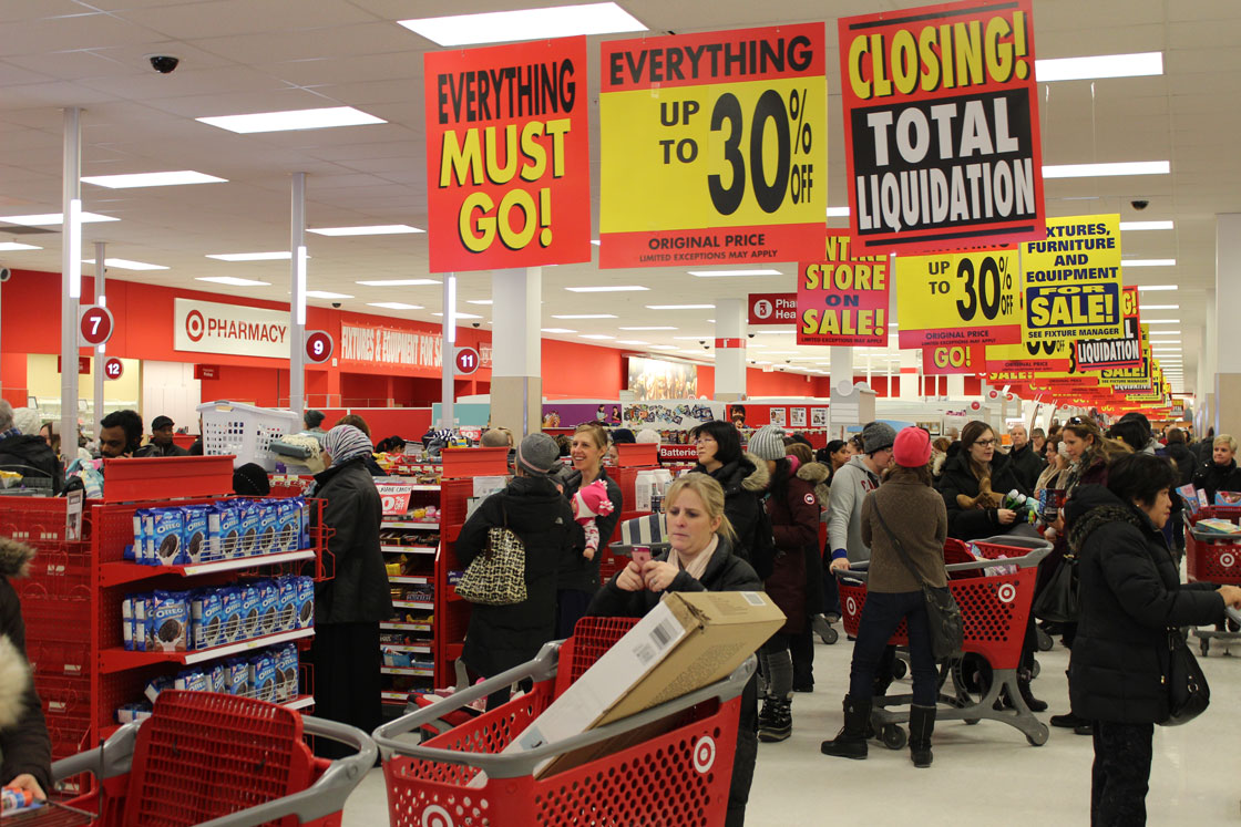 Shoppers at a Target store in Toronto queue up during the first day of clearance sales Thursday.