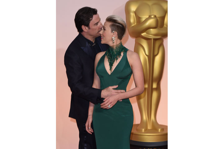 John Travolta and Scarlett Johansson, pictured at the Oscars on Feb. 22, 2015.