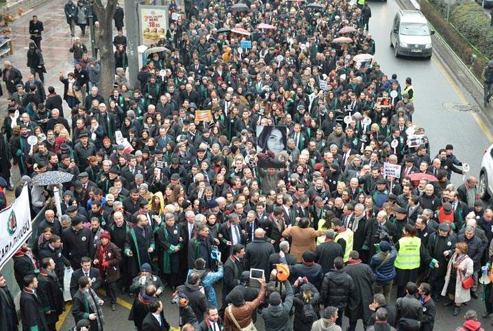 Members of Turkey’s Bar Associations hold a poster depicting slain Ozgecan Aslan, in Ankara, on February 16, 2015 during a march to protest against a law that strengthens the police’s power.