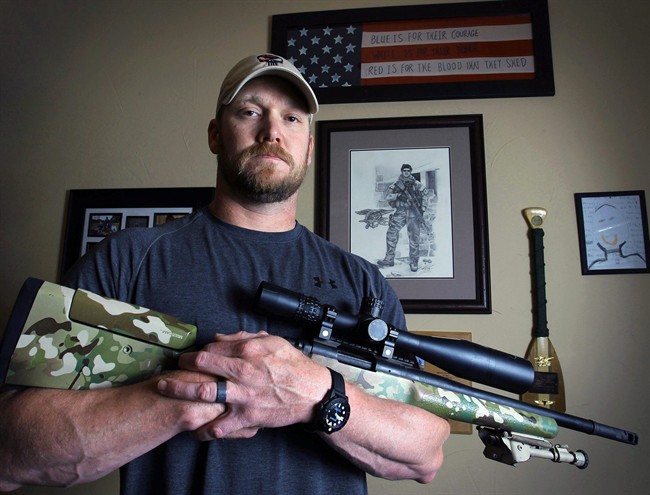 FILE - In this April 6, 2012, file photo, Chris Kyle, a former Navy SEAL and author of the book “American Sniper,” poses in Midlothian, Texas.