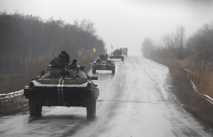 Ukranian military vehicles are seen driving on the road toward the town of Artemivsk, Ukraine on Feb. 1, 2015.