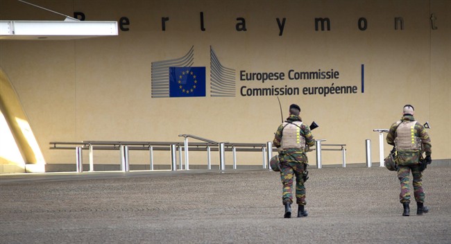 Two Belgian soldiers patrol outside EU headquarters in Brussels on Monday, Feb. 2, 2015. 
