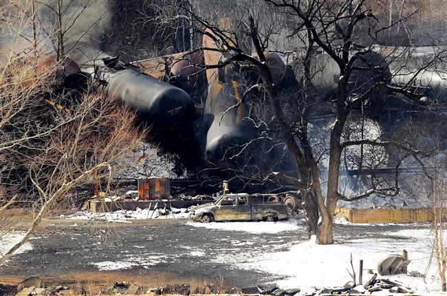 Train cars remain on the scene following a train derailment near Mount Carbon, W.Va., Tuesday, Feb. 17, 2015. 