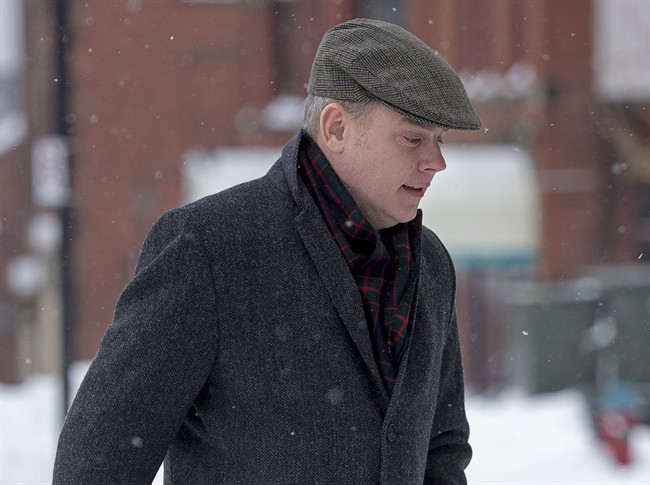 Dennis Oland, charged with second-degree murder in the death of his father, arrives to set a trial date at the Law Courts in Saint John, N.B. on Monday, Feb. 2, 2015. Richard Oland, 69, was found dead in his Saint John office on July 7, 2011. THE CANADIAN PRESS/Andrew Vaughan.