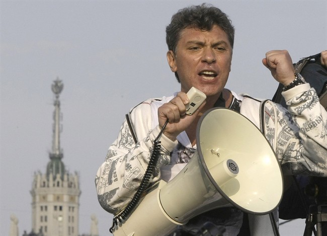 FILE - In this file photo taken on Sunday, May 6, 2012, Opposition leader Boris Nemtsov uses a loud speaker during an opposition rally in downtown Moscow, Russia. 