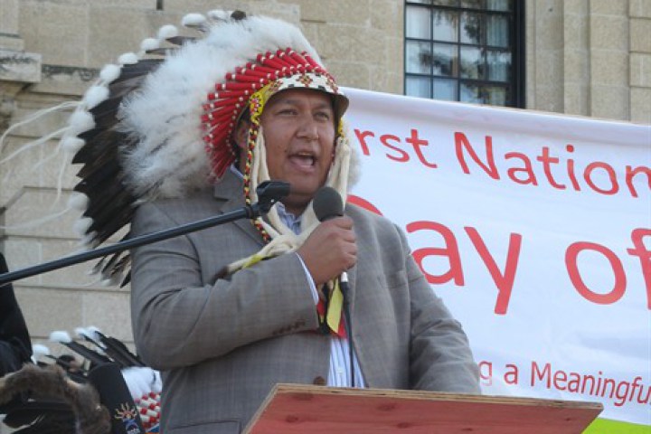 Chief Jeremy Fourhorns of the Piapot First Nation addresses hundreds of First Nations people who rallied at the Saskatchewan legislature Monday, Sept. 26, 2011 to call for better education and a bigger share of resource revenue.