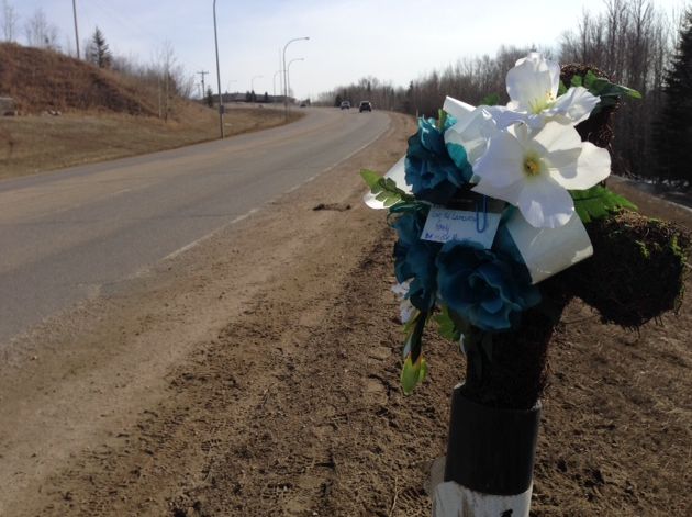 A bouquet of flowers at the scene of a fatal pedestrian crash in Athabasca on March 17, 2015.
