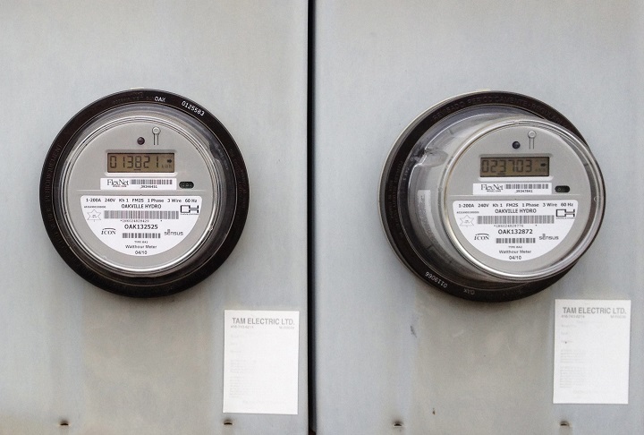 Hydro meters on the side of a housing unit in Oakville, Ont., Friday, Dec. 6, 2013. 