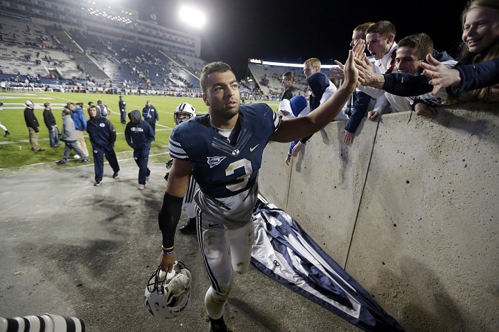 In this Sept. 27, 2013 file photo, then-BYU  linebacker Kyle Van Noy (3) high-fives fans as he walks off the field following an NCAA college football game against Middle Tennessee, in Provo, Utah. 