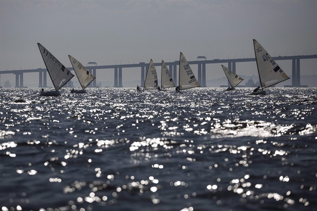 In this Aug. 3, 2014, file photo, athletes of the Finn class compete during the first test event for the Rio 2016 Olympic Games at the Guanabara Bay in Rio de Janeiro, Brazil.