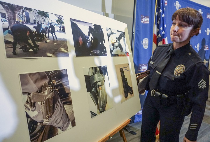 Los Angeles Police detective Meghan Aguilar explains images that could indicate evidence of a suspect holding a police officer's gun, seen in a video shot by a witness at the scene of the shooting of a homeless man on Skid Row in Los Angeles. 