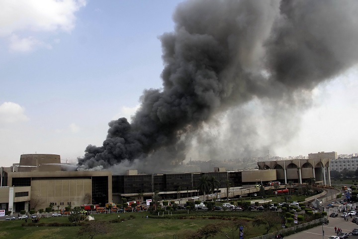 Smoke rises from a fire at Cairo's main convention center in the Nasr City neighborhood of the Egyptian capital Wednesday, March 4, 2015. 