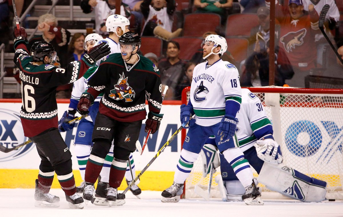 Arizona Coyotes' Tobias Rieder (8), of Germany, celebrates his goal against Vancouver Canucks' Eddie Lack  during the first period. 